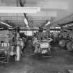 Interior.  First floor level, showing disused looms left behind after the closure of the mill