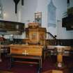 Interior. Platform area showing pulpit, font and communion table