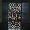 Interior. Ground floor NE aisle detail of heraldic stained glass window