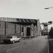 General view from SW along SE side of works (Ratho Street), 			with giant-cantilever crane beside James Watt Dock (NS27NE 17) in 		background, photographed 10 August 1993