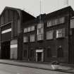 View from NW of centre of N frontage of works, containing  offices and N gable of Assemby Shop, photographed 10 August 1993
