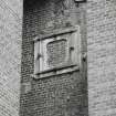 Detail of cast-iron wall box above rope pit.
