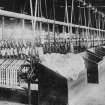 Copy of historic photograph showing interior view of reeling department.