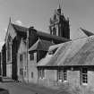 View of church, vestry and kitchen block from east