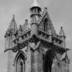 View of tower showing parapet and steeple from south