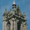 View of tower showing parapet and steeple from south