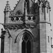 Detail of north side of tower showing carved heads and gargoyles