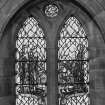 Interior.  View of stained glass window in north wall 'My soul doth magnify the Lord'