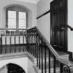 Interior.  Staircase leading to manager's room, view from landing to east