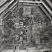 Interior.
View of exposed flue in W gable of attic.