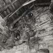 Interior.
View of E wall (including exposed chimney flues) on second floor.