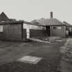 View of outbuildings from NE.