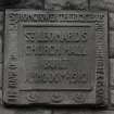 Detail of P Macgregor-Chalmers plaque inscribed "ST LEONARDS CHURCH HALL BUILT AD 1910"