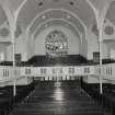 Interior. View from NW showing pews and galleries