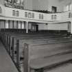 Interior. View from N showing pews and galleries