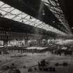 Interior.
View of rotary forge no 2 showing cooling and examination racks.