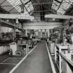Motherwell, Craigneuk Street, Anderson Boyes
Machine Shop (Dept. 66, adjacent to Fitting Shop, built in 1942): Interior view of south end of west bay from N, showing ranges of machine tools and associated small cranes