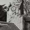 Detail of clock tower in N courtyard.