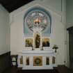 Interior. E side chapel, view of altar from N