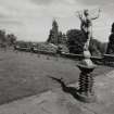 View of Terrace with basin and statue on brick plinths