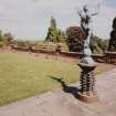 View of Terrace with sundial and statue on brick plinths