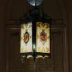 Entrance porch, detail of light fitting with the initials and the coat of arms of the 11th Lord Blantyre