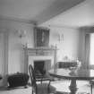 Interior view of Linhouse showing room with fireplace. 