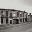 General view from W of High Street frontage, showing pend leading to yard.  Photosurvey 22-APR-1992