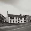 View from WNW of two-storeyed buildings fronting onto High Street Photosurvey 22-APR-1992