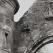 Detail of gargoyle on archway linking gate lodges.