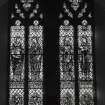 Interior, detail of W stained glass window depicting The 4 Apostles
