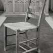 Interior, detail of original rush seated nave chair