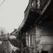 Detail of ornate iron stair and balcony leading to upper floor on E side of building fronting High Street Photosurvey 22-APR-1992