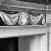 Interior view of Newhailes House showing detail of lion carving in overmantle of dining room fireplace.