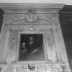 Interior view of Newhailes House showing detail of library overmantle by William Strachan and Thomas Clayton with portrait of Sir David Dalrymple and his son James by Sir John de Medina.