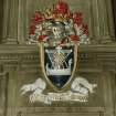 Interior.
Detail of coat of arms over W fireplace in Council Chamber.