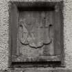 Detail of N doorway armorial panel.