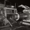 Interior.
View of recoiling of steel strip at end of inspection line and stretch level.