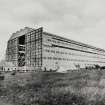 Copy of historic photograph showing general view of construction shed.