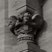 Detail of carved angel on S facade.
