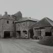 General view of mill from NW, showing two kilns on left, and extension undergoing conversion to dwelling on right.