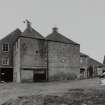 General view of mill from N, showing two kilns in foreground.