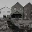 View of mill from S, showing water wheel house.