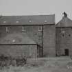 View of mill from E, prior to removal of building on E of mill.