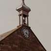 View of E gable clock and bellcote.