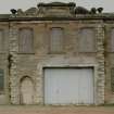 View from SSE of S elevation of central mill showing pediment dated 1857.