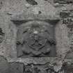 Detail of carved stone depicting an eagle on W range, probably part of an ornamental well-head.
