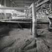 Steep Room: interior view from E into Steep No.1, showing recently steeped barley, and odd-numbered steeping vessels in background