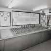 Console Room:  view from SE of main control panel, with barley lorry outside (backround) waiting to unload.  The Console Room is situated at the ground floor level of the adjacent Silo Block (to the SW), and the control panel was manufactured by 'Electric Construction'