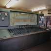 Console Room:  view from SE of main control panel, with barley lorry outside (backround) waiting to unload.  The Console Room is situated at the ground floor level of the adjacent Silo Block (to the SW), and the control panel was manufactured by 'Electric Construction'